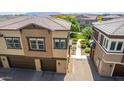 New townhome with a private entrance and paved driveway at 14870 W Encanto Blvd # 2138, Goodyear, AZ 85395