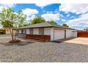 Charming home featuring an attached two-car garage and a neatly maintained exterior at 1756 N Summer Cir, Mesa, AZ 85203