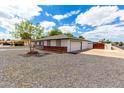 Single-story home with a two-car garage and well-kept grounds at 1756 N Summer Cir, Mesa, AZ 85203