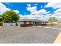 Well-kept single-story home featuring a gravel yard and a classic design at 1756 N Summer Cir, Mesa, AZ 85203