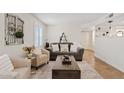 Comfortable living room with stylish furniture, decor, plantation shutters, and a decorative rug at 2229 N Middlecoff Dr, Mesa, AZ 85215
