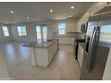 Contemporary kitchen with stainless steel appliances and granite countertops with an island at 22400 W Monona Ln, Surprise, AZ 85387