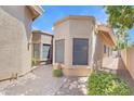 Exterior shot of the house showcasing the walkway, landscaping, and architectural details at 2663 N Carriage Ln, Chandler, AZ 85224