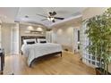 Serene main bedroom featuring a ceiling fan, recessed lighting, and light hardwood flooring at 3002 E Montecito Ave, Phoenix, AZ 85016