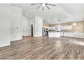 Spacious open-concept living area featuring tile floors, recessed lighting, and a vaulted ceiling at 3044 E Sparrow Pl, Chandler, AZ 85286
