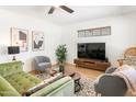 Bright living room featuring modern furniture, stylish decor, and wood-look floors at 3115 N 34Th Pl, Phoenix, AZ 85018
