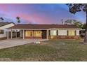 Charming single-story home with a well-maintained lawn and a convenient carport, nestled in a quiet neighborhood at 317 E Belmont Ave, Phoenix, AZ 85020
