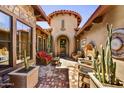 Private courtyard with desert landscaping and comfortable outdoor seating at 4050 N Terra Mesa Cir, Mesa, AZ 85207