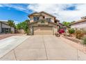Charming two-story home featuring an attached two car garage and extended driveway at 4062 W Cielo Grande --, Glendale, AZ 85310
