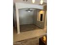 Open living space with tile and wood floors, neutral paint and a modern ceiling fan at 4130 E Megan St, Gilbert, AZ 85295