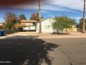 The exterior of the home includes a covered parking area and low-maintenance landscaping at 42 W Thomas Ln, Tempe, AZ 85281