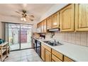 Bright kitchen featuring sliding glass doors to an outdoor patio area and tiled countertops at 8241 N Central Ave # 2, Phoenix, AZ 85020