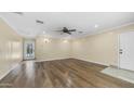 Open living area features wood-look floors and easy access to the backyard pool at 1001 W Northern Ave, Phoenix, AZ 85021