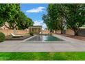 Inviting backyard pool and deck area, perfect for relaxation and entertainment at 1377 W Park Ave, Gilbert, AZ 85233