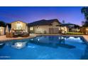 Backyard oasis featuring a pool, patio furniture, and outdoor grill, perfect for entertaining at 1934 E Cypress Tree Dr, Gilbert, AZ 85234