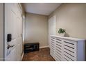 Inviting foyer features tile flooring, shoe storage, a bench, and a clean, organized space at 205 N 74Th St # 201, Mesa, AZ 85207