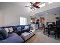 Cozy living room with a plush sectional, kitchen view, dining area, and bright, airy feel from high ceilings at 205 N 74Th St # 201, Mesa, AZ 85207
