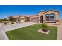 Beautiful desert home with neat landscaping, a spacious driveway, and a two-car garage at 29109 N Fire Agate Rd, San Tan Valley, AZ 85143