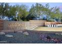 Grand entrance to Anthem Country Club showcasing a water feature and desert-inspired landscaping at 41602 N Congressional Dr, Phoenix, AZ 85086