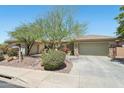 Beautiful single story home with desert landscaping and stone accents at 41602 N Congressional Dr, Phoenix, AZ 85086