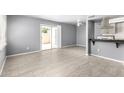 Bright, open-concept living area featuring tile floors and access to the backyard at 5201 N 42Nd N Pkwy, Phoenix, AZ 85019
