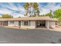 Charming single-story home with covered carport and low maintenance front yard at 524 W Fairway Dr # 9, Mesa, AZ 85201