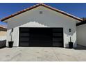 Modern garage with a glass door and black accents, providing secure parking at 5430 E Shea Blvd, Scottsdale, AZ 85254