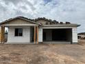 New construction exterior shows a home with an attached two car garage and desert landscaping at 5507 W Piedmont Rd, Laveen, AZ 85339
