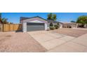 This single story home with a 2 car garage has a well maintained front yard at 5534 W Calavar Rd, Glendale, AZ 85306