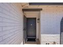 Inviting front entry with a white brick facade and a stylish security door at 5534 W Calavar Rd, Glendale, AZ 85306