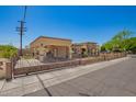 Charming home featuring beautiful stonework, a gated yard, and a covered parking area at 6459 W Columbus Ave, Phoenix, AZ 85033