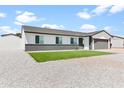 Inviting one-story home featuring a manicured lawn and a stone driveway at 6908 W Sierra St, Peoria, AZ 85345