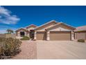 Lovely single-story house featuring a tile roof, desert landscaping, and a spacious two-car garage at 6988 W Monte Lindo --, Glendale, AZ 85310