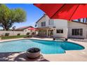 Backyard pool and outdoor seating area perfect for entertaining guests and enjoying outdoor relaxation at 9012 E Sutton Dr, Scottsdale, AZ 85260