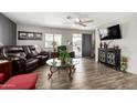 Comfortable living room with cozy seating, sleek entertainment center, and seamless indoor-outdoor flow at 9333 E University Dr # 83, Mesa, AZ 85207