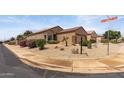 Corner lot with a single-story home featuring desert landscaping and a two-car garage at 16205 W Mountain Pass Dr, Surprise, AZ 85374