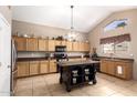 Well-appointed kitchen with granite countertops, large island, and stainless steel appliances at 1737 E Primera Dr, Casa Grande, AZ 85122