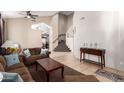 Inviting living room with high ceilings, tile floors, and easy access to stairway at 1737 E Primera Dr, Casa Grande, AZ 85122