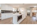 Contemporary kitchen featuring a center island, modern appliances, and white cabinetry at 1747 W Echo Ln, Phoenix, AZ 85021