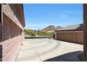 View of the long driveway and desert landscape from the front of the home at 26814 N 65Th Dr, Phoenix, AZ 85083