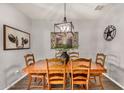 Nicely decorated dining room featuring wood floors and an eye-catching light fixture at 30238 N Ocotillo Dr, Florence, AZ 85132