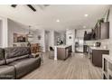 Open-concept living and kitchen area with stainless steel appliances and a center island at 30238 N Ocotillo Dr, Florence, AZ 85132