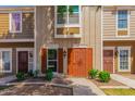 A straight-on shot of four townhomes showing the front doors and front windows of each home at 3416 W Julie Dr # 4, Phoenix, AZ 85027