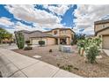 Desert landscaping surrounds this two-story home, complemented by a spacious three-car garage at 3555 E Morenci Rd, San Tan Valley, AZ 85143
