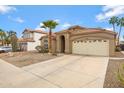 Inviting single-story home with attached two-car garage, desert landscaping and long driveway at 3711 E Long Lake Rd, Phoenix, AZ 85048