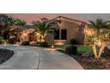 Beautiful single-story desert home with circle driveway and tasteful landscaping at 3754 E Flintlock Dr, Queen Creek, AZ 85142