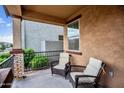 Relaxing front porch featuring comfortable seating, decorative iron railing, and an inviting outdoor space at 4156 E Jesse St, Gilbert, AZ 85295