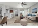 Inviting living room with neutral décor, plush seating, and a view to the outdoor patio at 4413 E Odessa Dr, San Tan Valley, AZ 85140