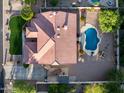 Detailed aerial view of the property featuring a pool and well-maintained landscaping at 4637 W Misty Willow Ln, Glendale, AZ 85310