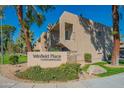 Well-maintained Winfield Place Condominiums with manicured landscaping and inviting signage at 7436 E Chaparral Rd # B246, Scottsdale, AZ 85250